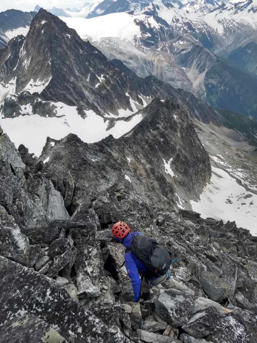 mountaineer scrambling down avalanche mountain south ridge