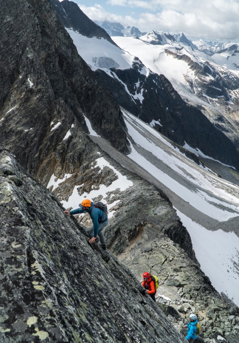 two climbers taking on the first pitch of uto peak southwest ridge