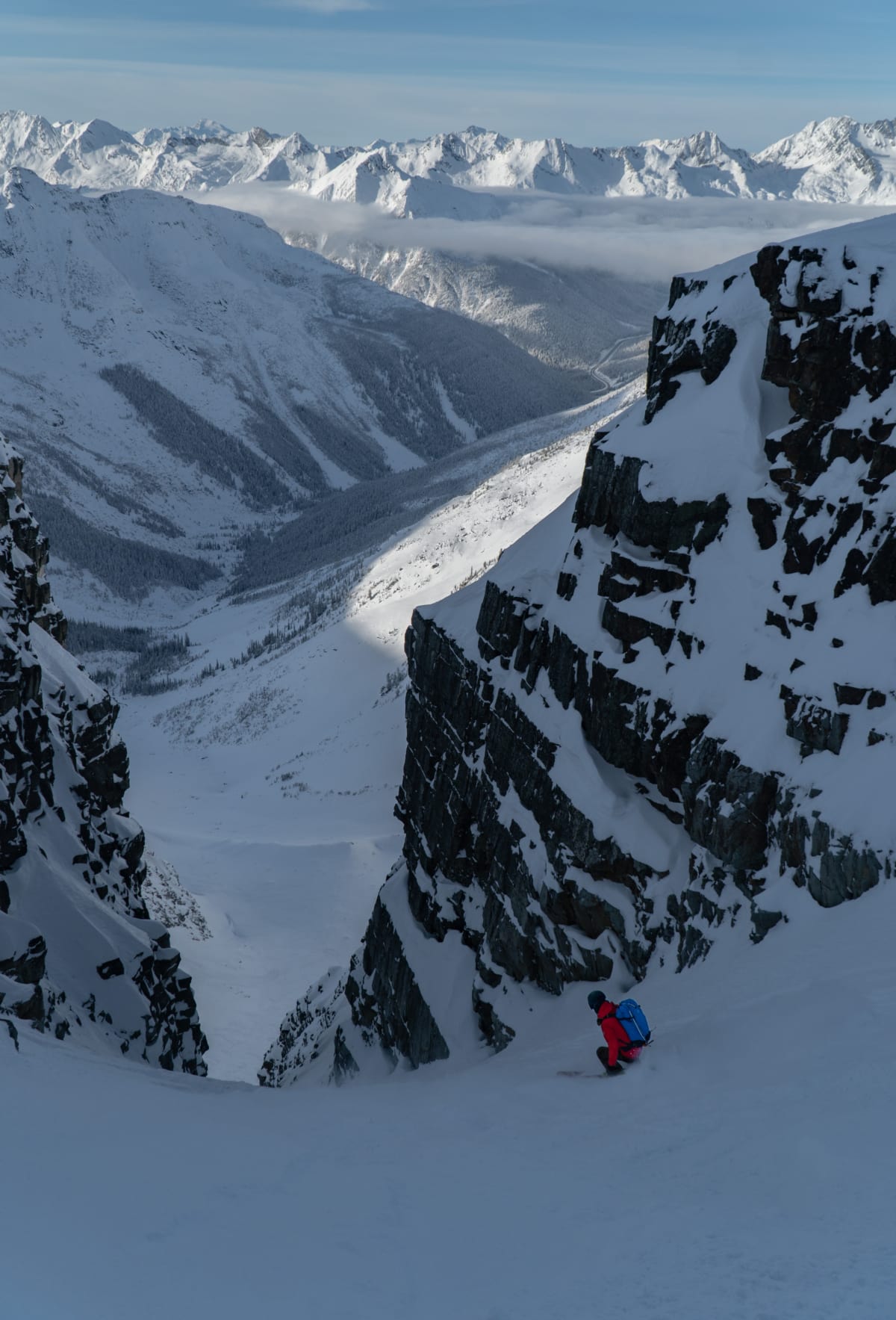 skier carving a turn down the forever young couloir