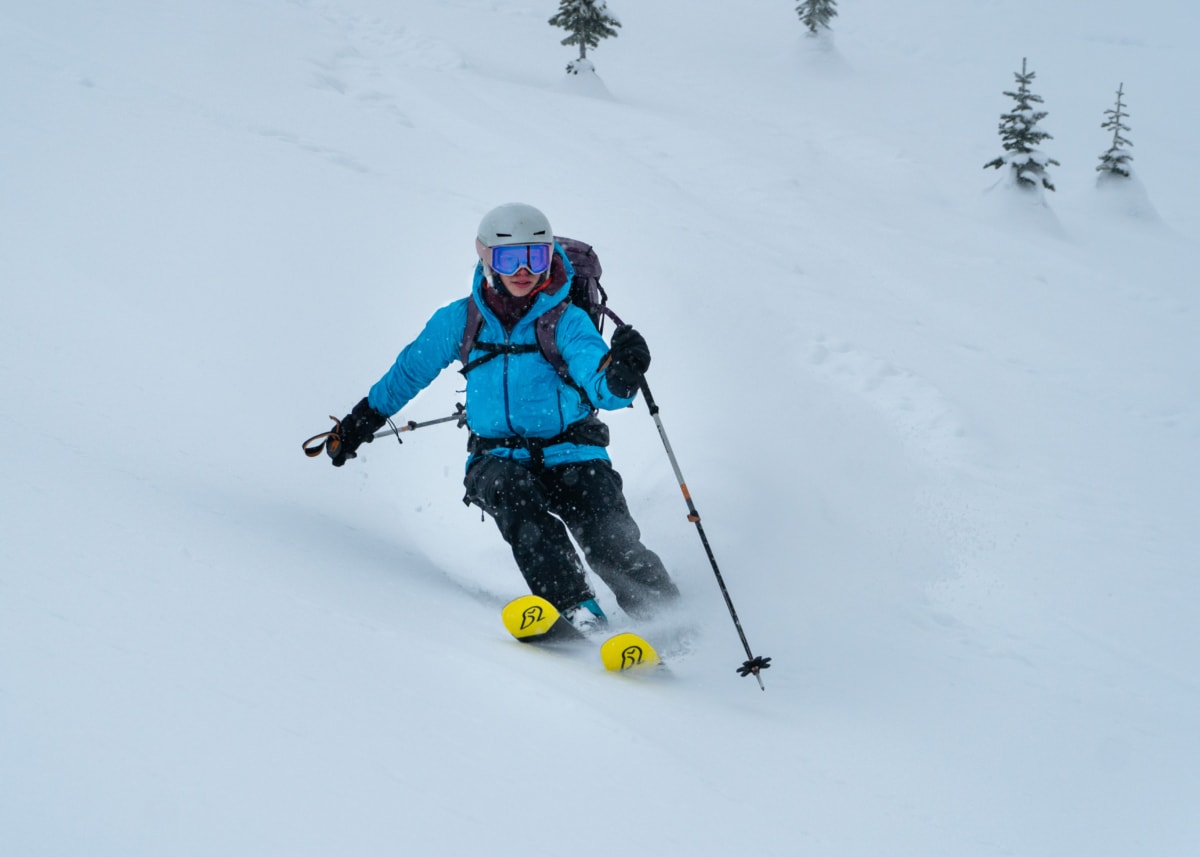 skier skiing through boot deep powder