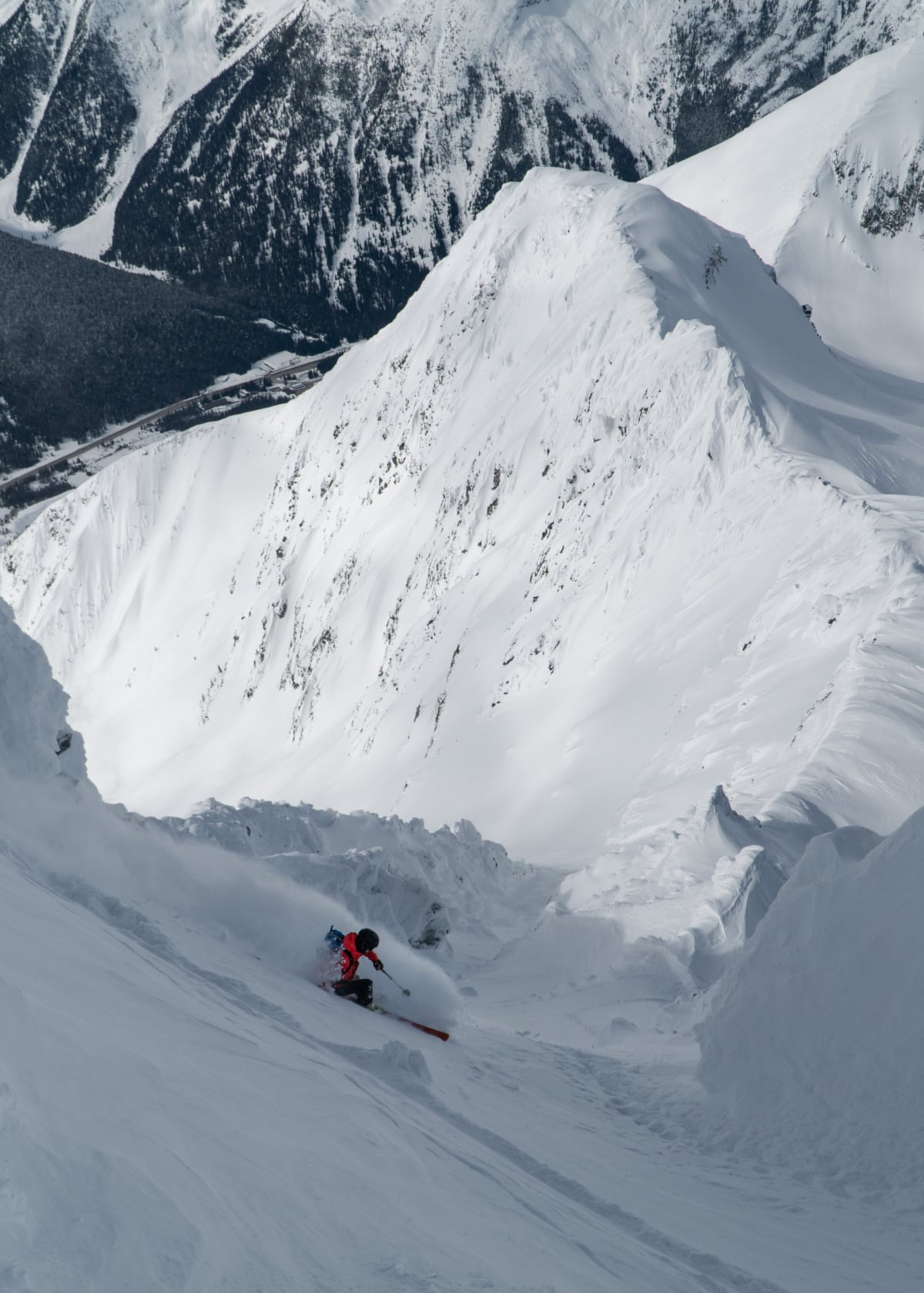 skier carving a turn down the avalanche nw couloir