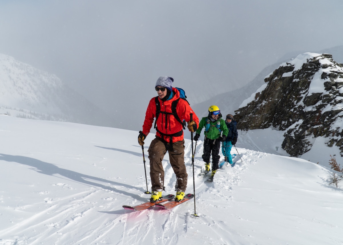 three ski tourers walking up bruins ridge