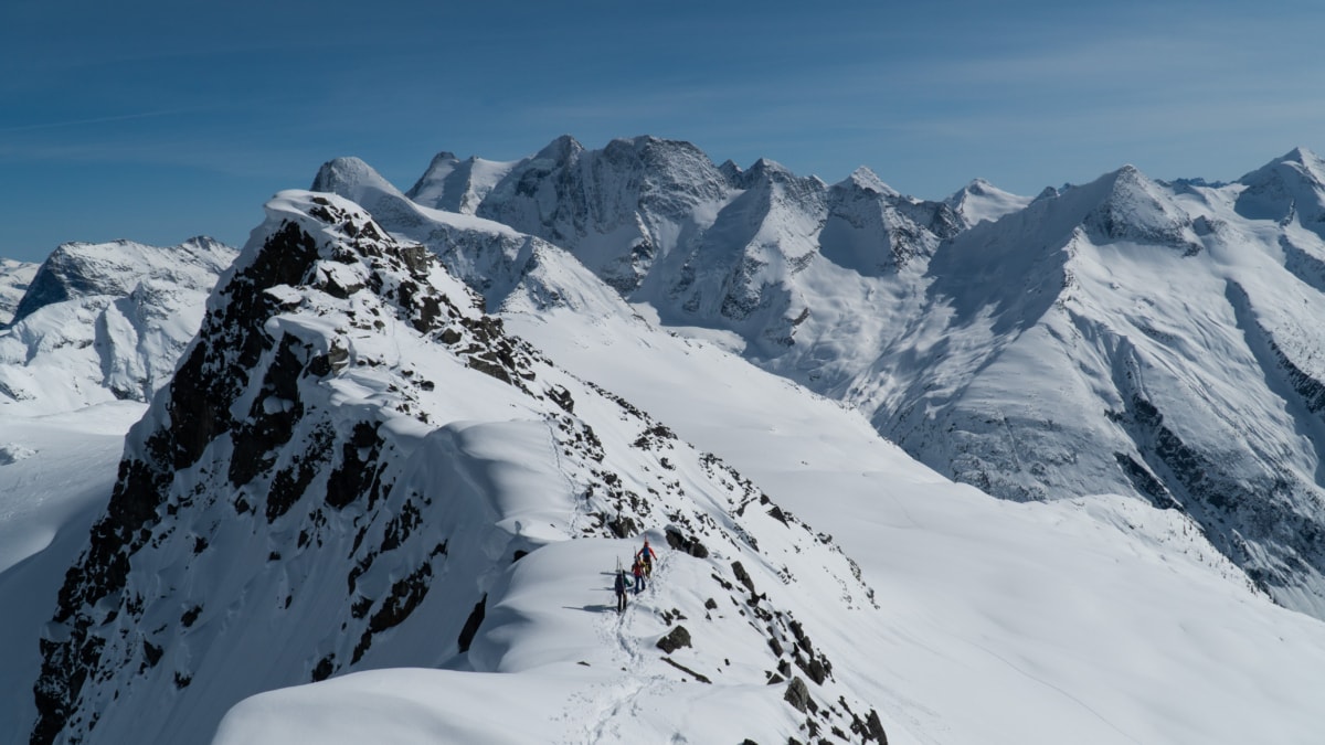 group of mountaineers on the jupiter traverse high on an alpine ridge