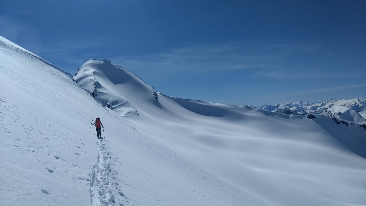 man traversing the durrand glacier on skis