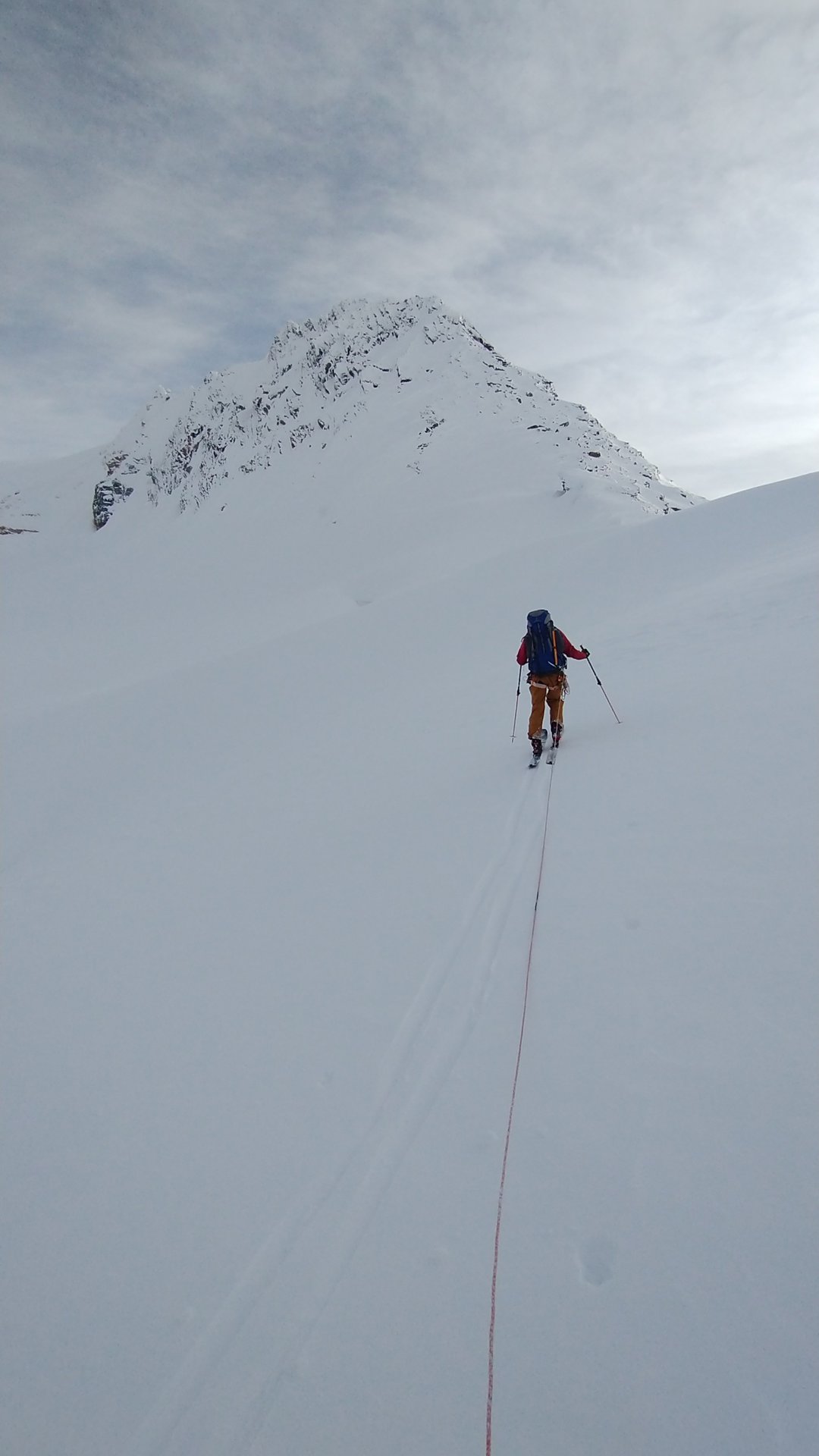 ski tourer travelling along the northwest face of youngs peak
